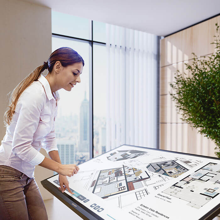 woman using interactive display in office